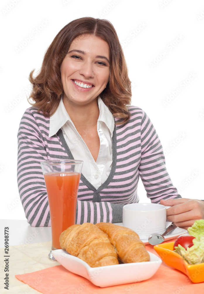 Woman smiling having breakfast