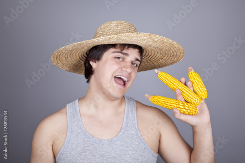 Funny farmer in cap with three corns.