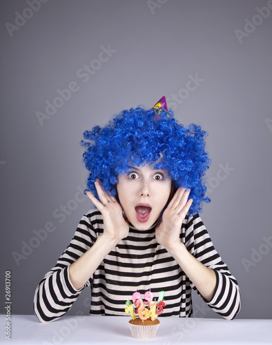 Funny blue-hair girl with cake.