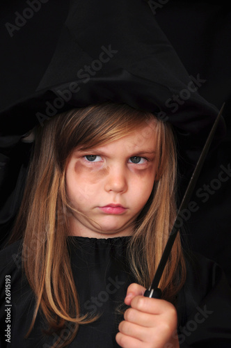 Girl disguised as a witch for Halloween
