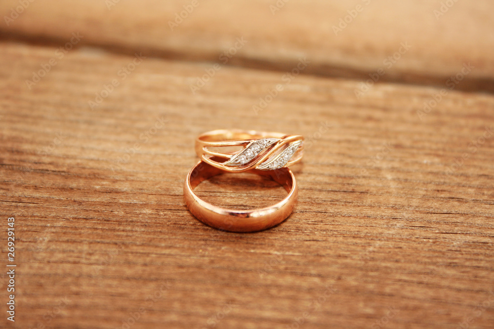 wedding rings on the wooden background wedding rings on the wooden background