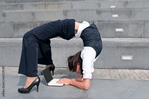 Flexible business - woman with laptob photo