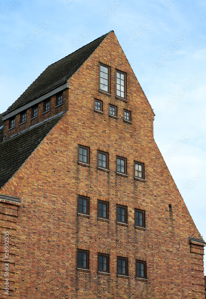 old brick stone building on german harbor in rostock