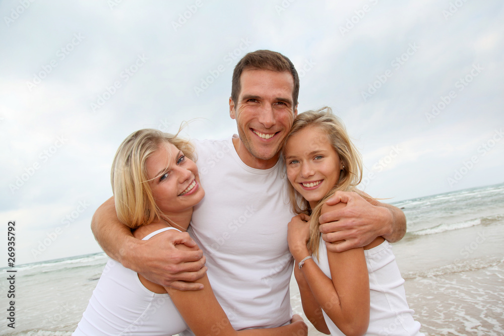 Portrait of happy family at the beach