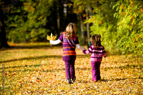 little girls in the autumn park