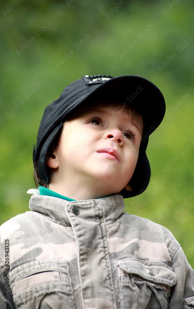 Portrait of a little boy in hat, looking up Portrait of a little boy in hat, looking up
