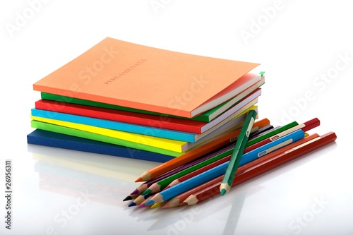 stack of books and 12 crayons
