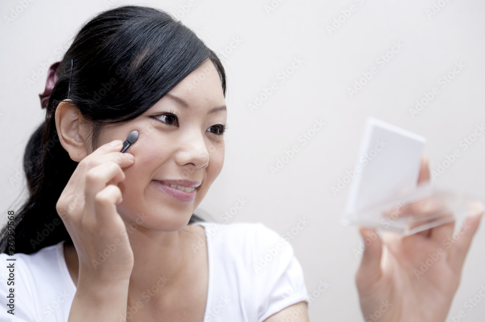 portrait of beautiful japanese girl doing make up portrait of beautiful japanese girl doing make up