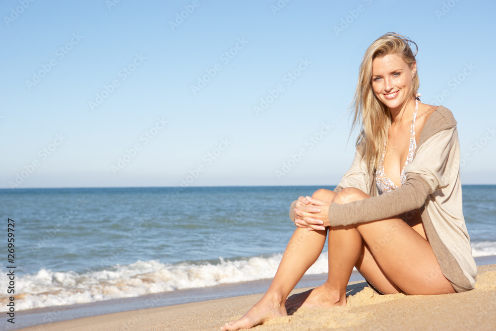Young Woman Relaxing On Beach
