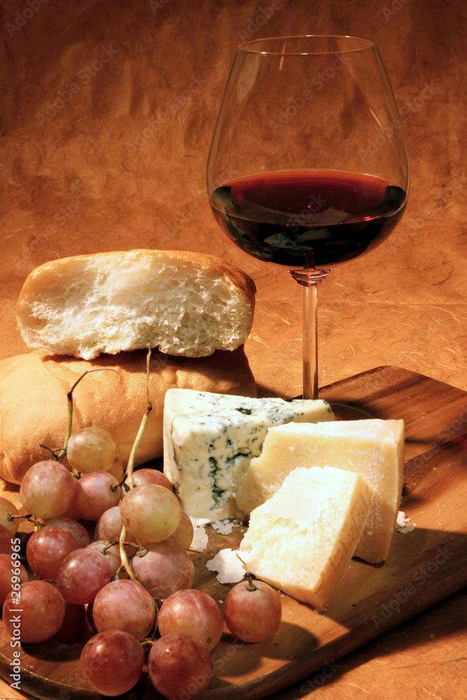Still-life with red wine and cheese