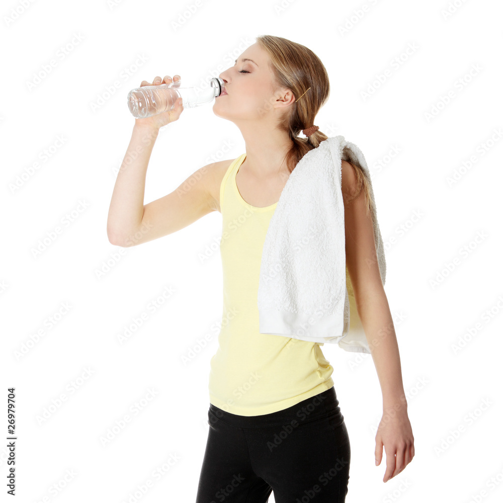 Young girl with bottle of mineral water Young girl with bottle of mineral water