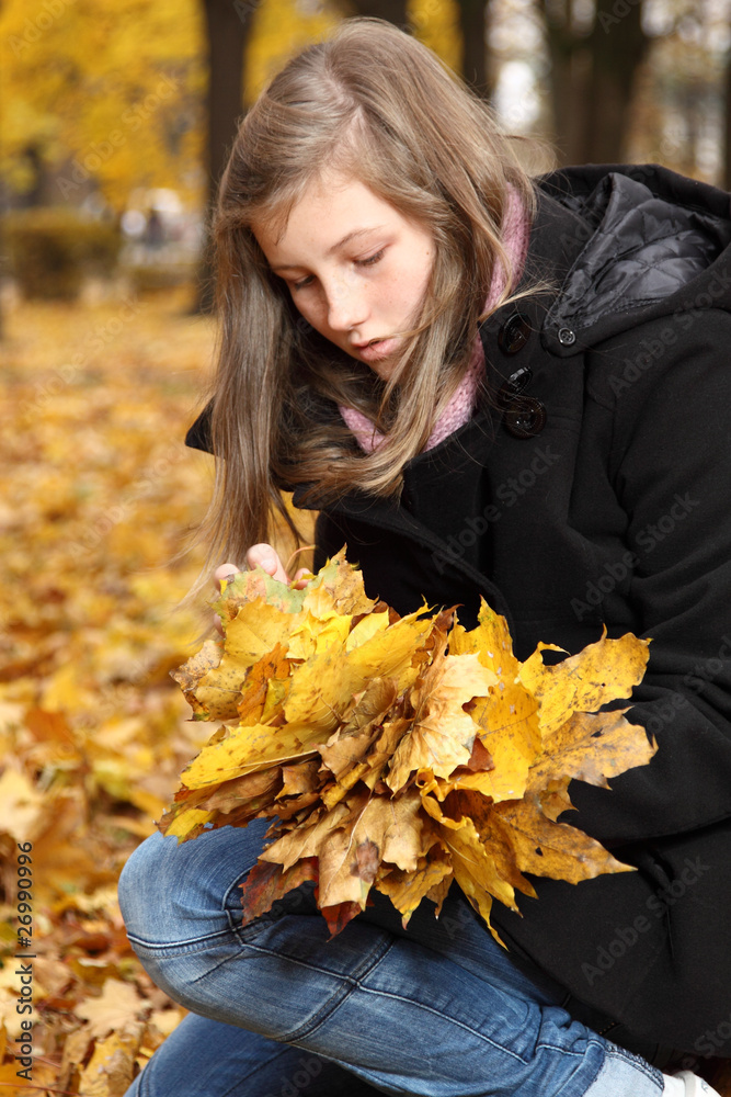 teenager in a park in autumn teenager in a park in autumn