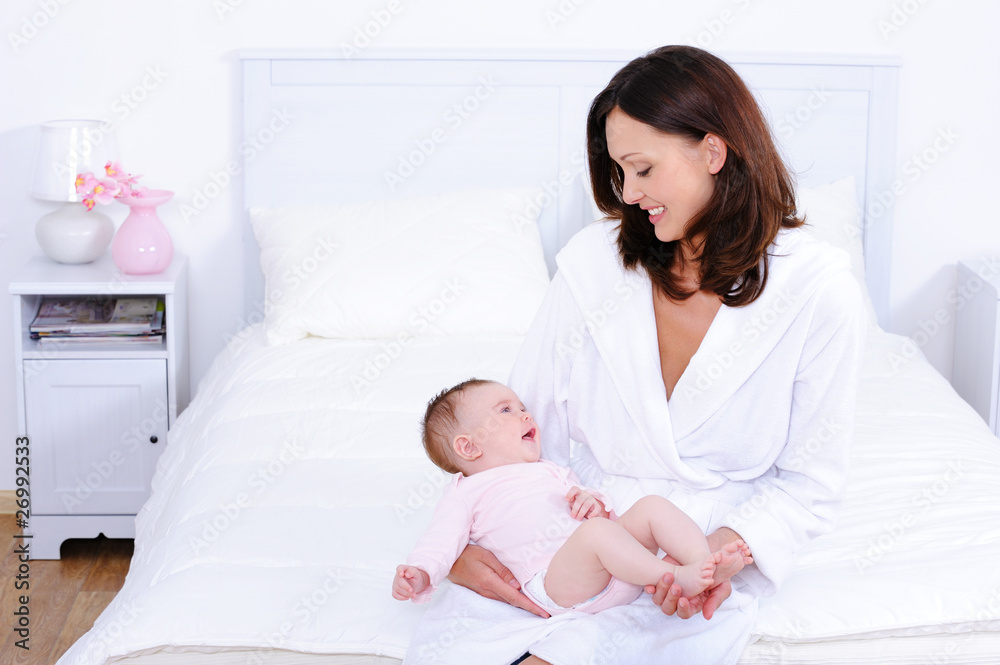 Mother with baby in bedroom Mother with baby in bedroom