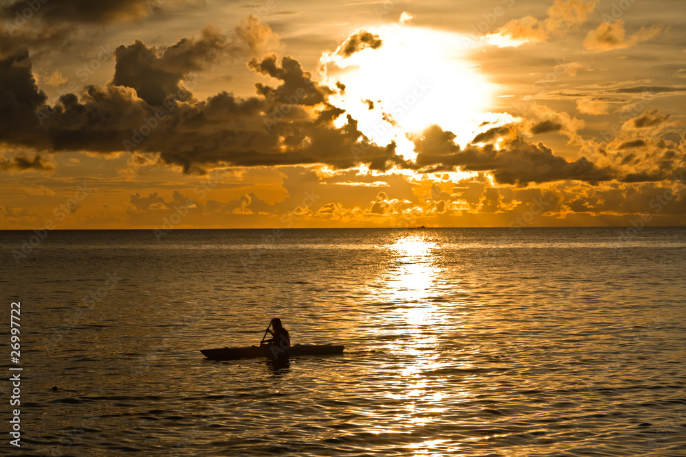 Sunset at South China Sea with canoe in Phu Quoc, Vietnam