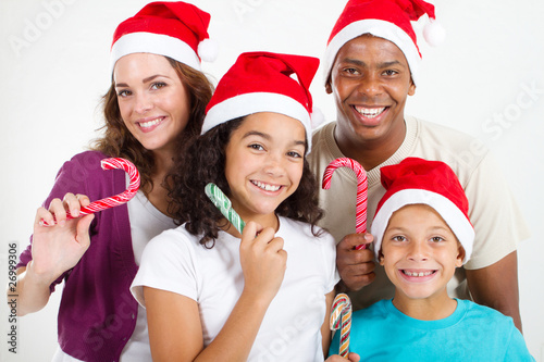 happy christmas family holding candy canes