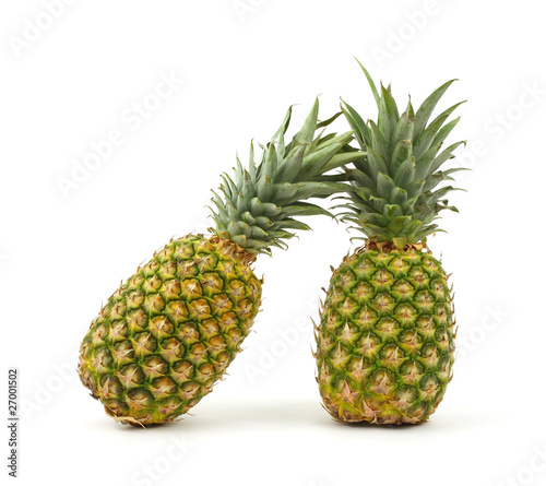 Two pineapples on white background