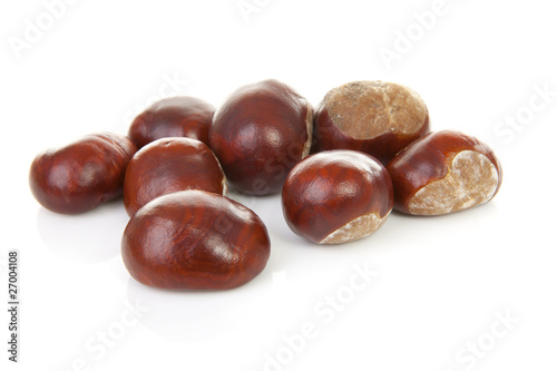 couple of chestnuts over white background