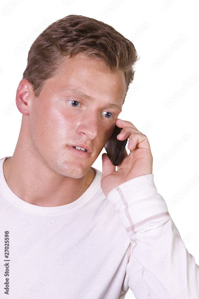 Young businessman conversing on cell phone Young businessman conversing on cell phone