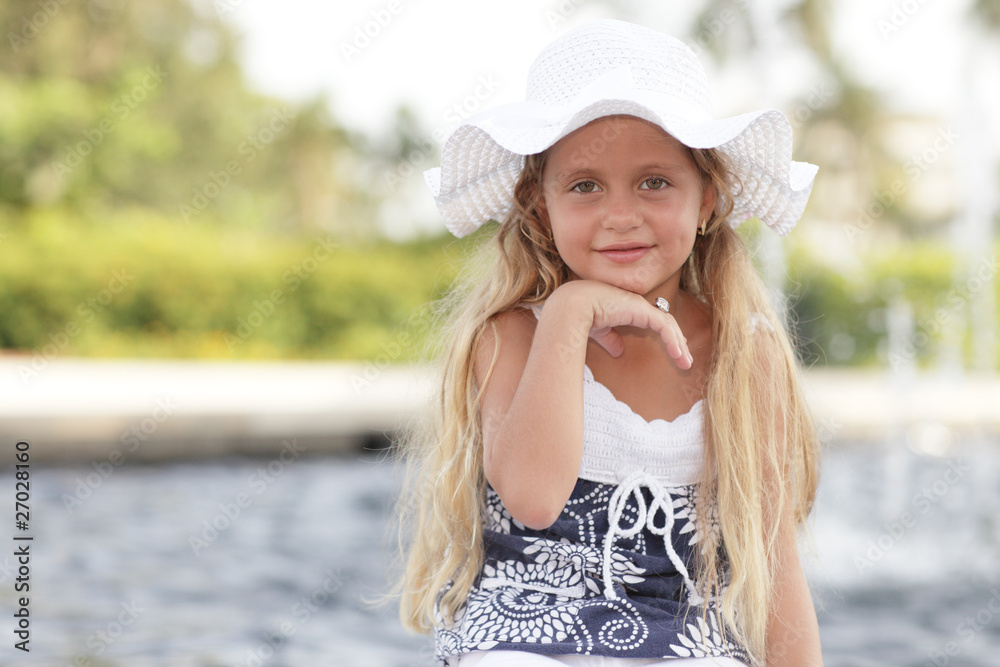Young child wearing a hat