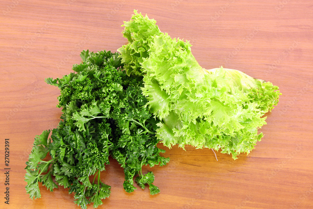 Green salad on wooden background Green salad on wooden background