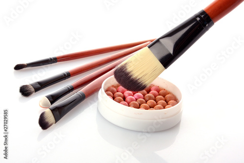 cosmetic brush on cosmetics background