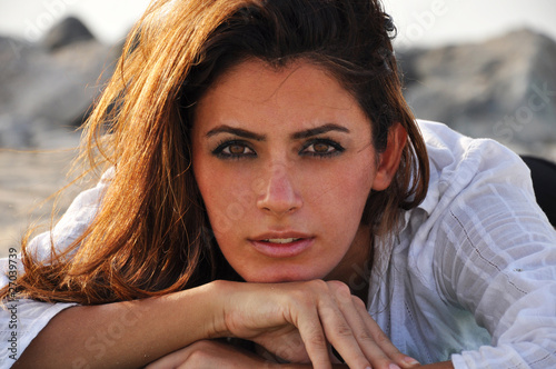 Beautiful woman on the beach at sunset