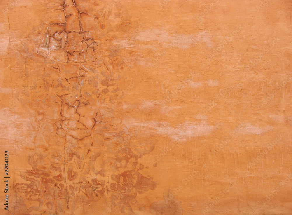 orange colored grunge wall with stains and marks