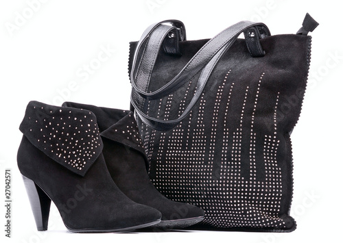 Pair of black female suede boots and suede bag