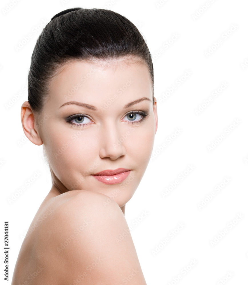 Fototapeta premium female face of young woman with clean skin - isolated