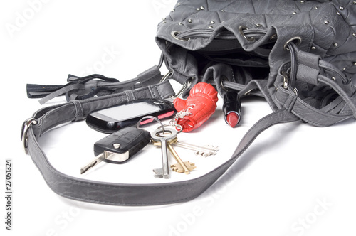 lipstick, phona and keys out of handbag