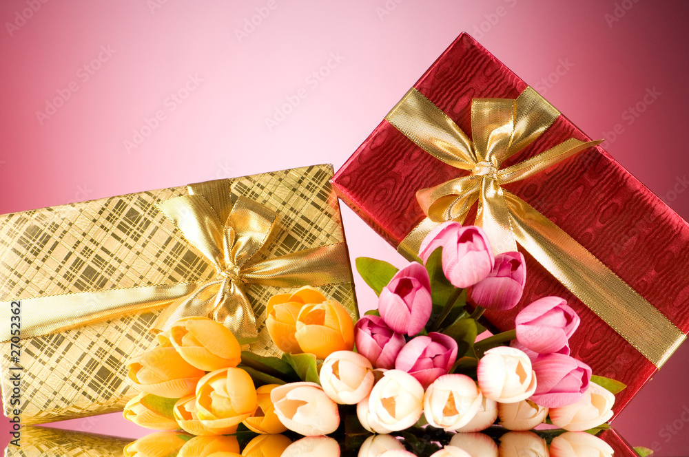 Celebration concept - gift box and tulip flowers Celebration concept - gift box and tulip flowers