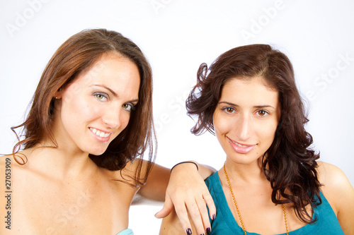 Two women talking and looking at cam