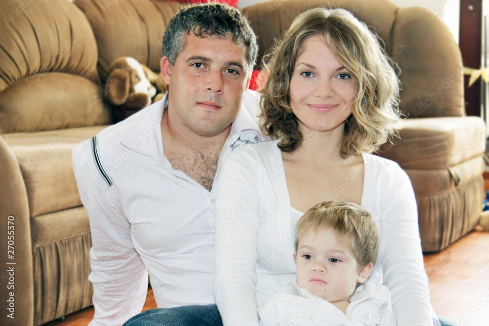 Fototapeta premium young loving family at home