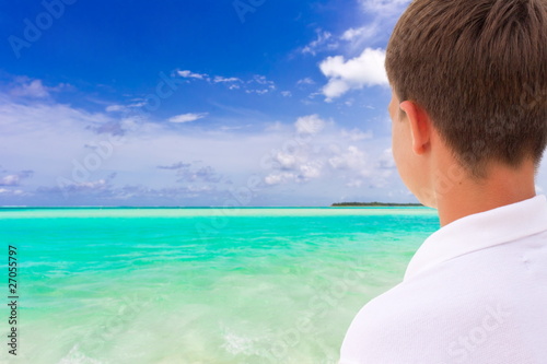 Boy looking at tropical sea