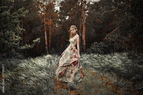 Portrait of romantic woman in fairy forest