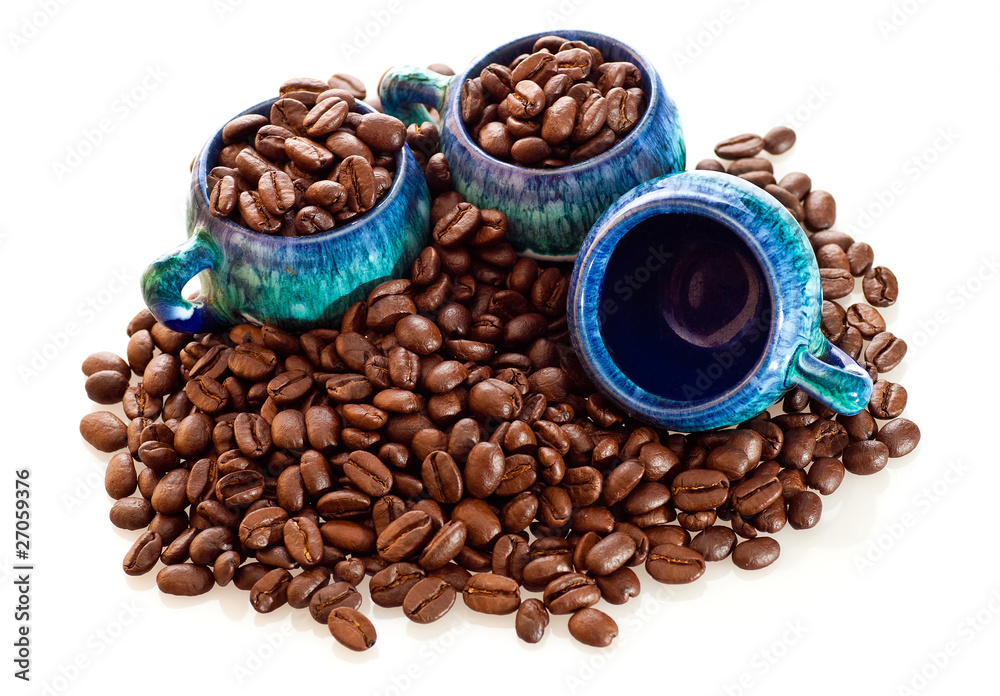 Coffee beans and cups on a white background Coffee beans and cups on a white background