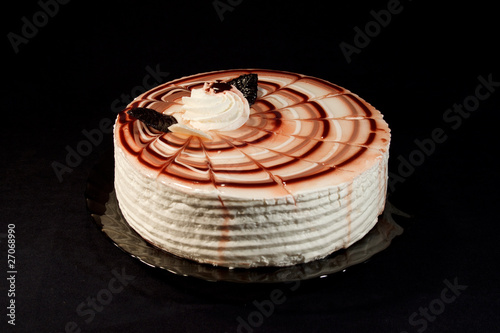 cake on a plate on a black background