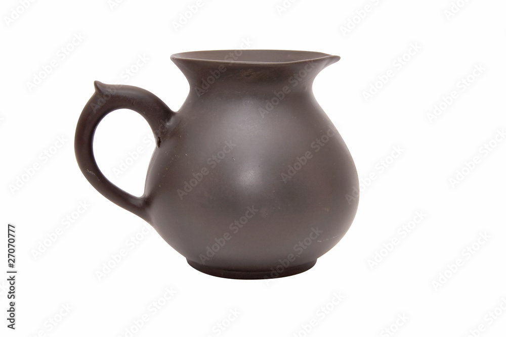 Earthenware jug on a white background