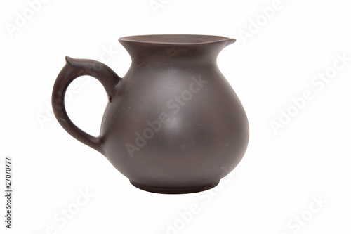 Earthenware jug on a white background