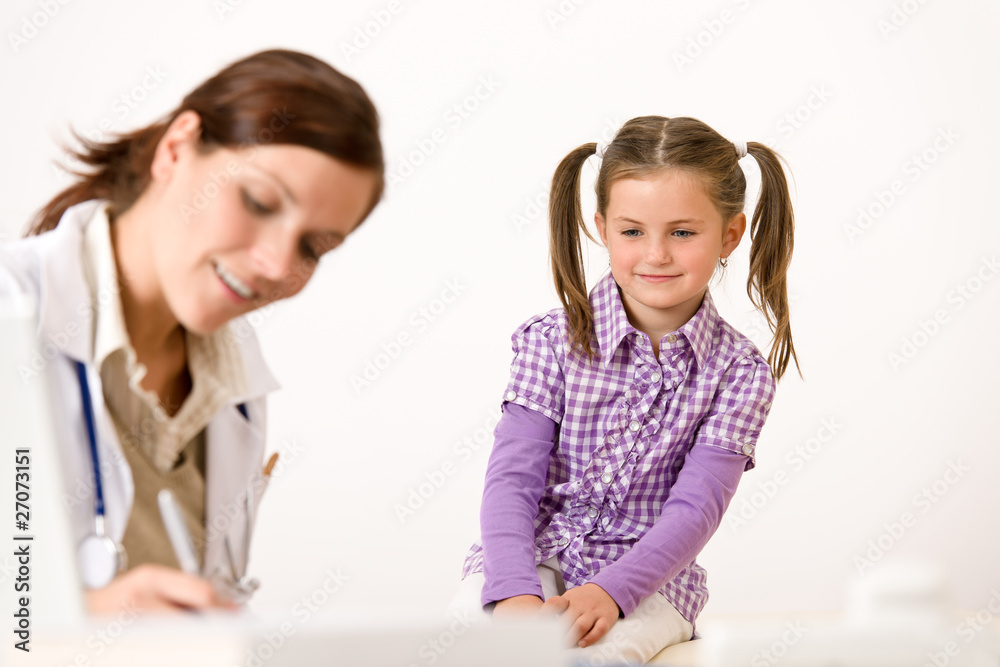 Female doctor write prescription for child Female doctor write prescription for child