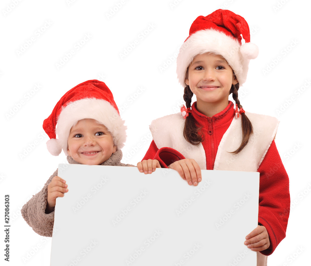Little children in Christmas hats with an empty banner Little children in Christmas hats with an empty banner