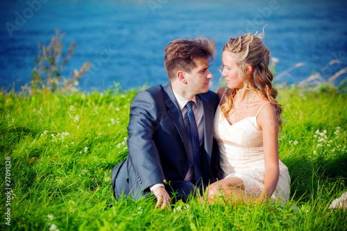 Wedding couple near a pond © Julia Shepeleva