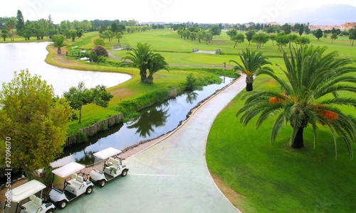 Fototapeta Naklejka Na Ścianę i Meble -  Golf course lakes palm trees aerial view