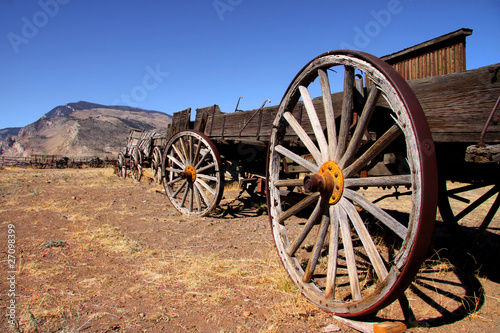 Old carts in a Ghost town near Cody, Wyoming photo