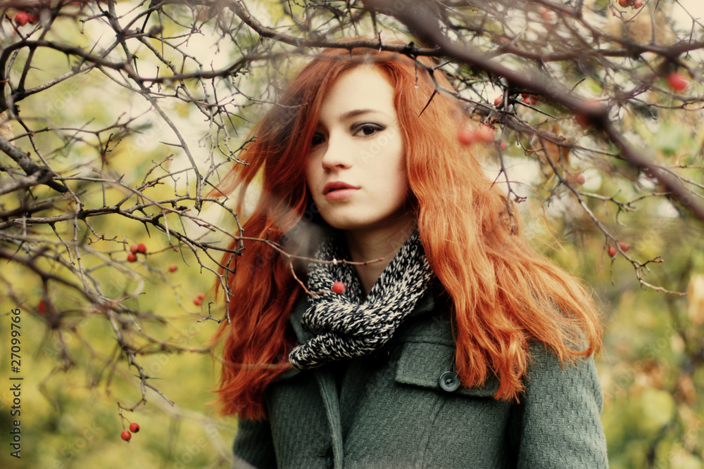 Young woman in branches of a hawthorn Young woman in branches of a hawthorn