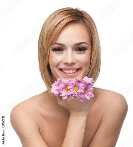 portrait of a happy young woman resting her chin on flowers