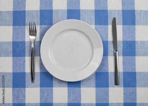 Knife, white plate and fork...