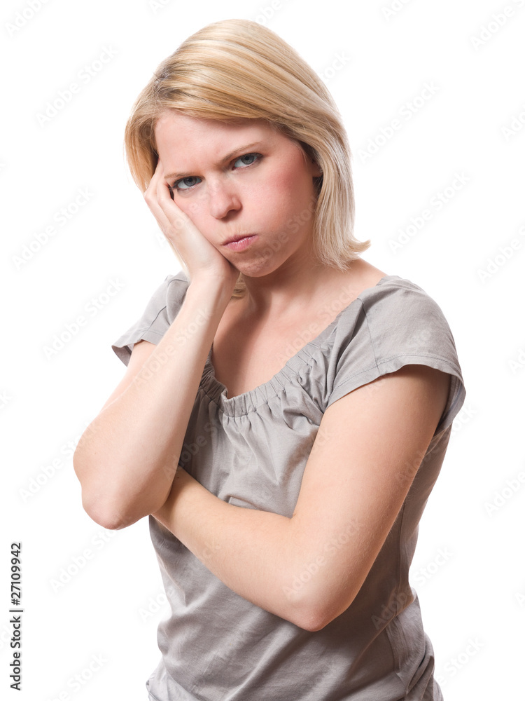 young woman with bored expression isolated on white young woman with bored expression isolated on white