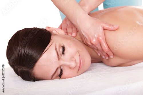 Young woman having massage. Isolated.