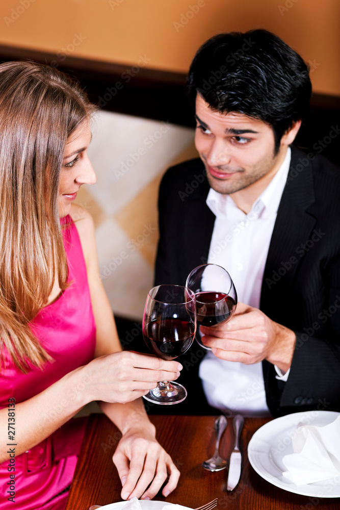 Couple having red wine in restaurant Couple having red wine in restaurant